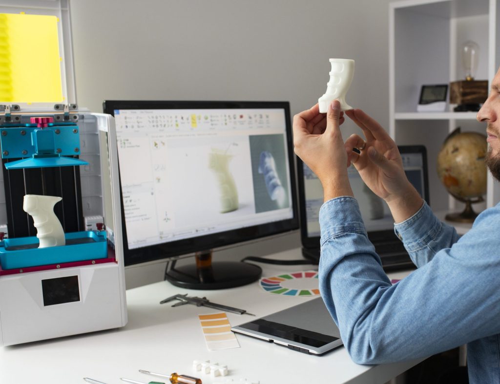 Medtech designer using 3d printer